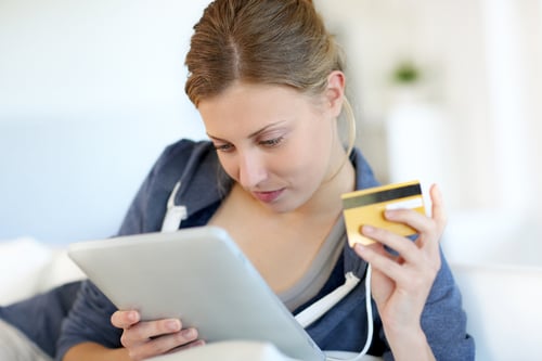 Closeup of beautiful blond girl doing online shopping-1