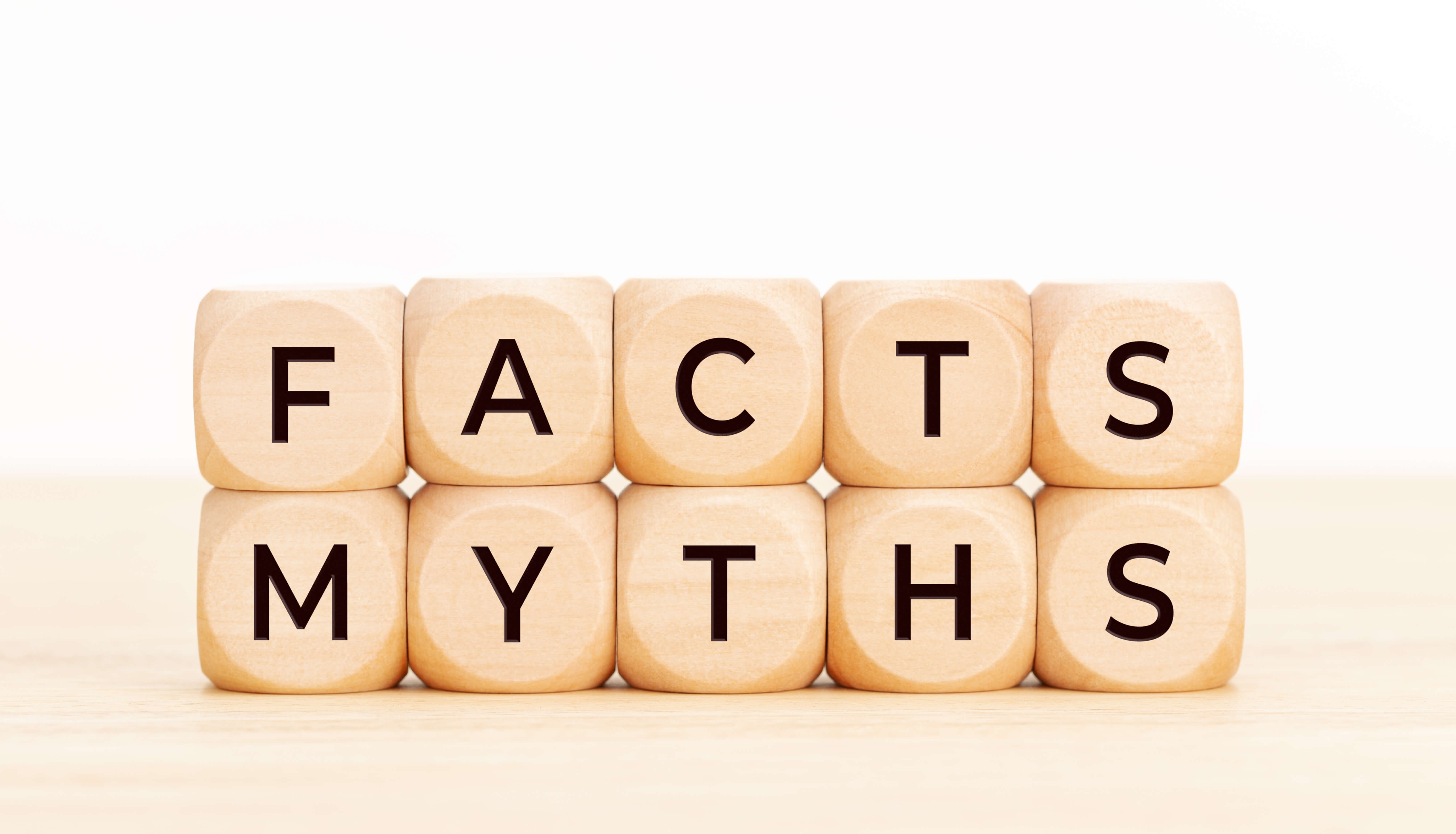 Wooden blocks spell the words Facts and Myths
