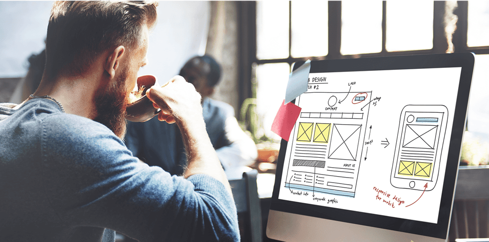Shopify merchant at viewing a computer and thinking about homepage personalization