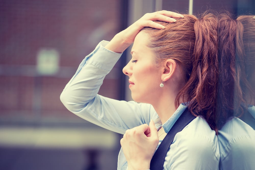 portrait stressed sad young woman outdoors. City urban life style stress