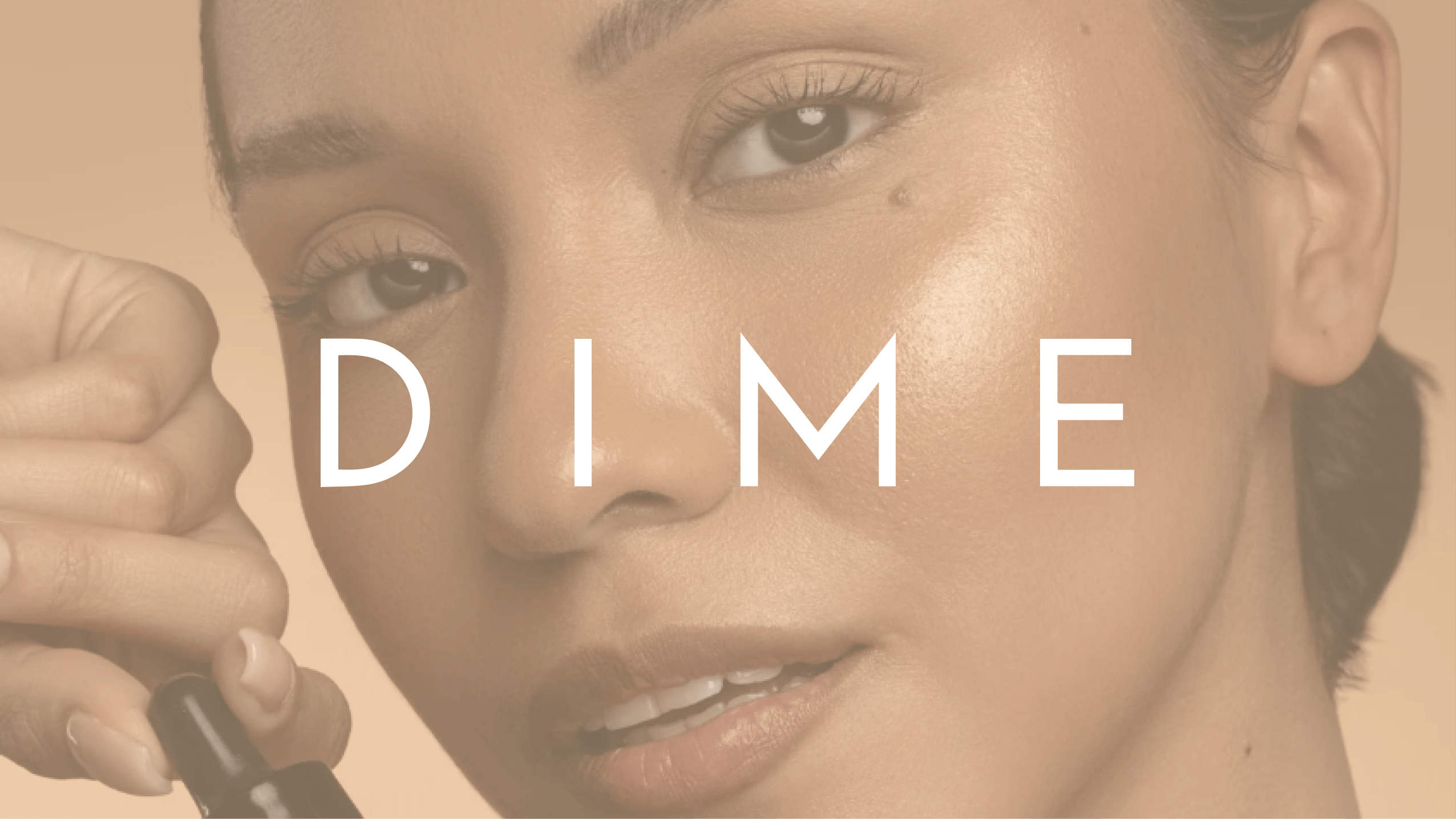 DIME logo over top of a woman smiling holding one of their beauty products