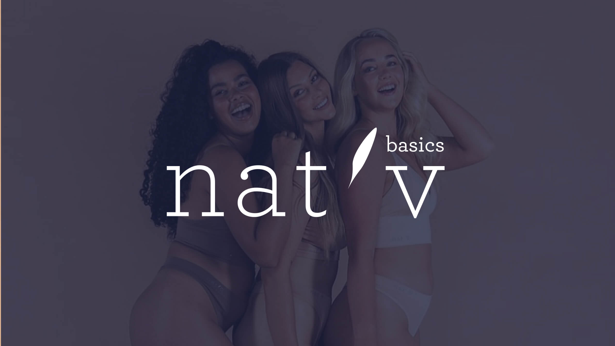 Smiling underwear models posing behind the nat'v logo.
